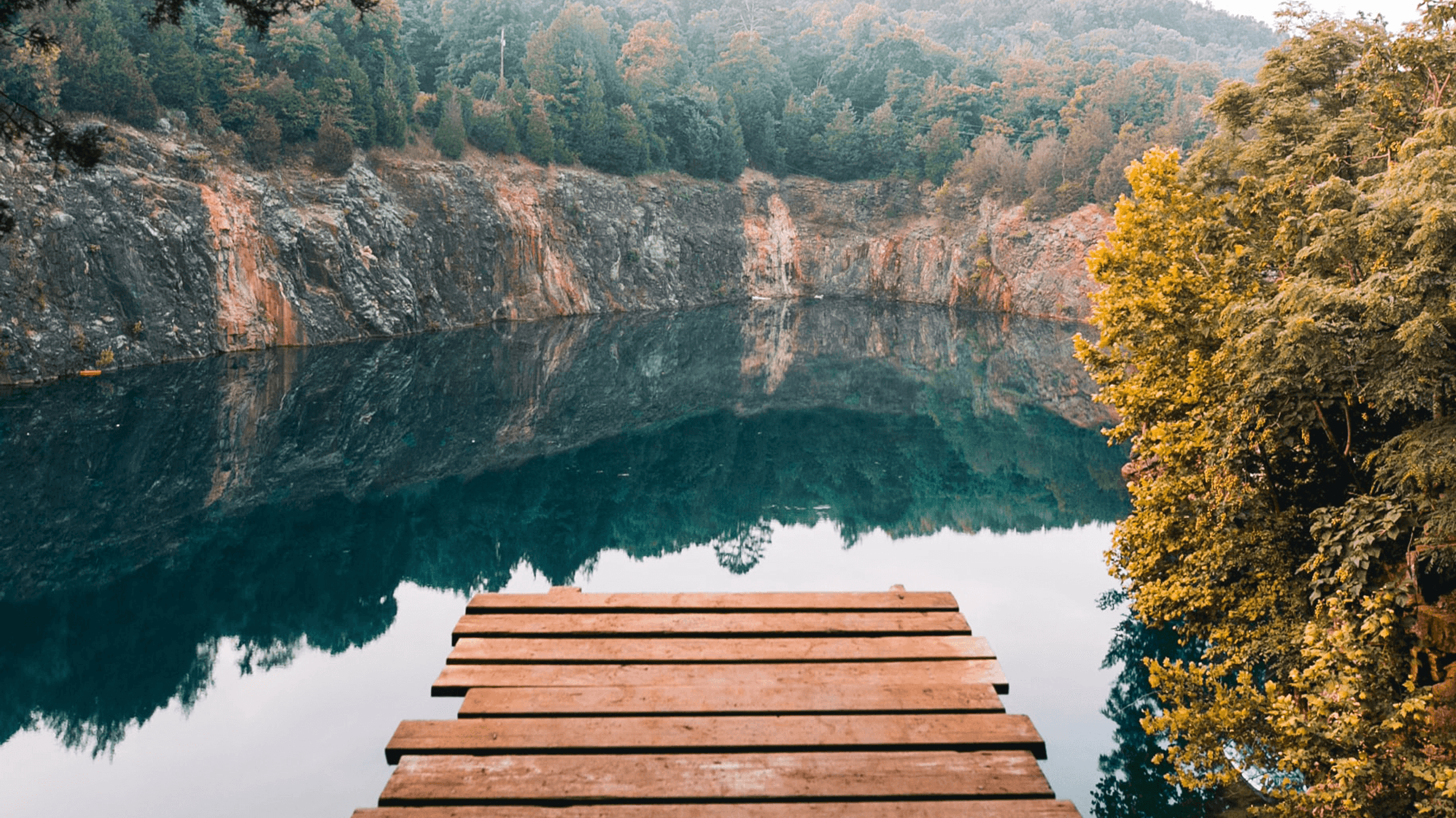 Boardwalk to lake near mountains