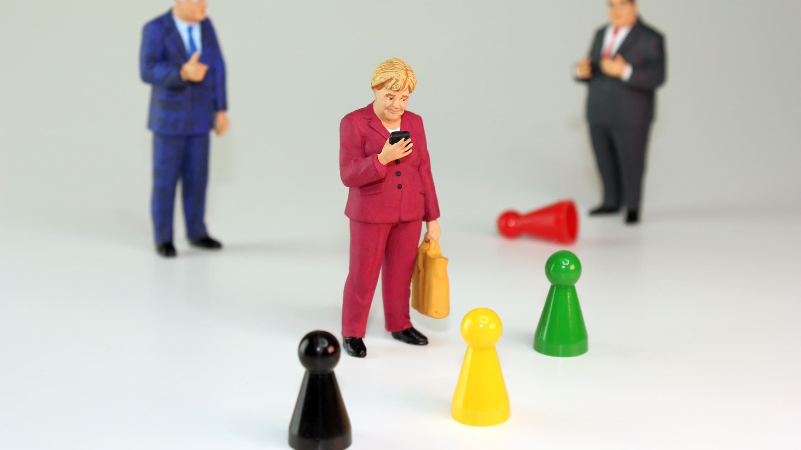 Angela Merkel doll on phone